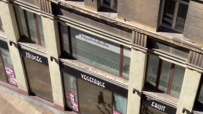Anastasia Ocean - A woman undresses on a balcony in the city center. Public flashing.